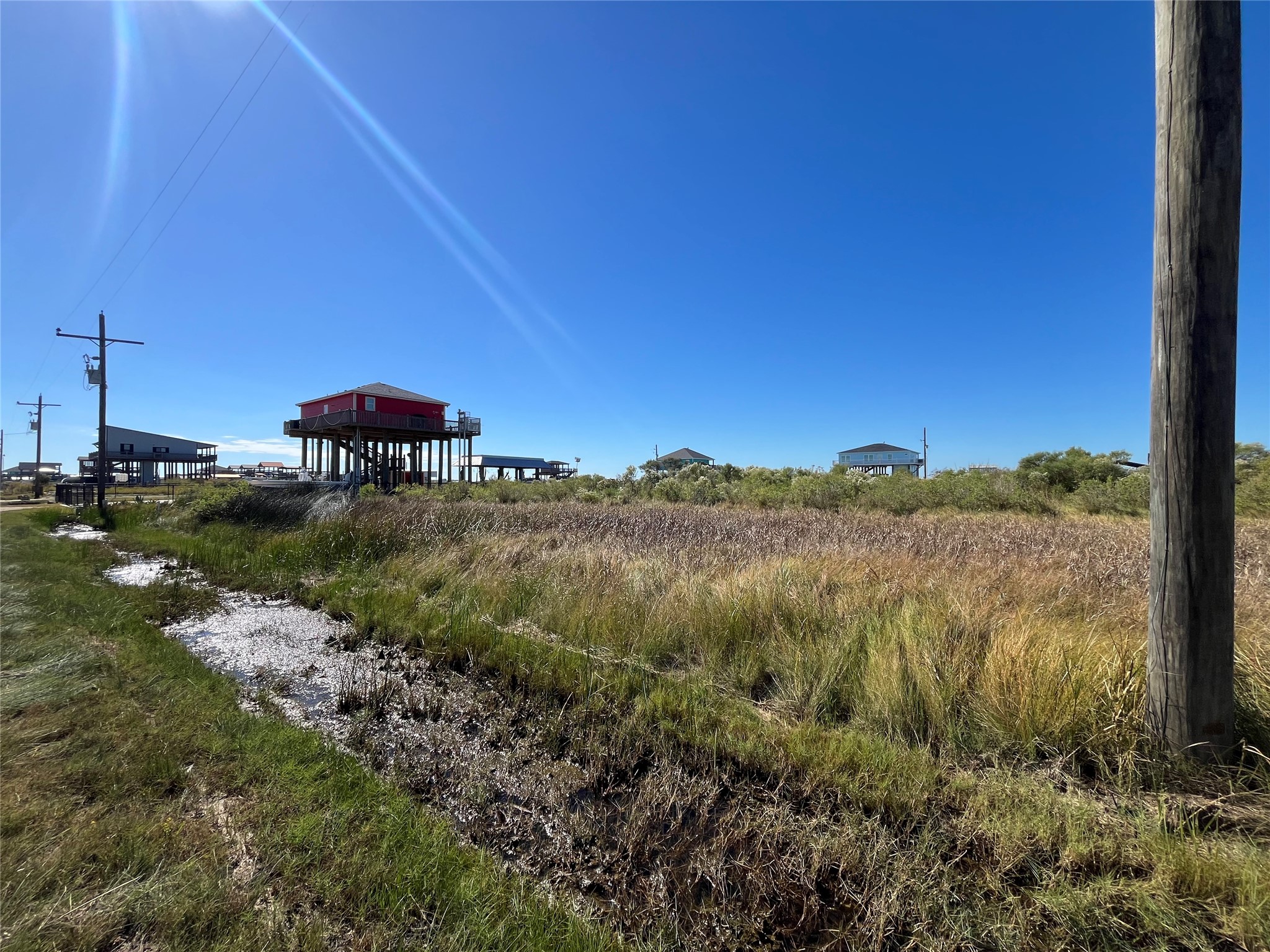 0 Mabry Street Port Bolivar, TX 77650 - Photo 2 of 11 a view of a lake with a mountain in the background