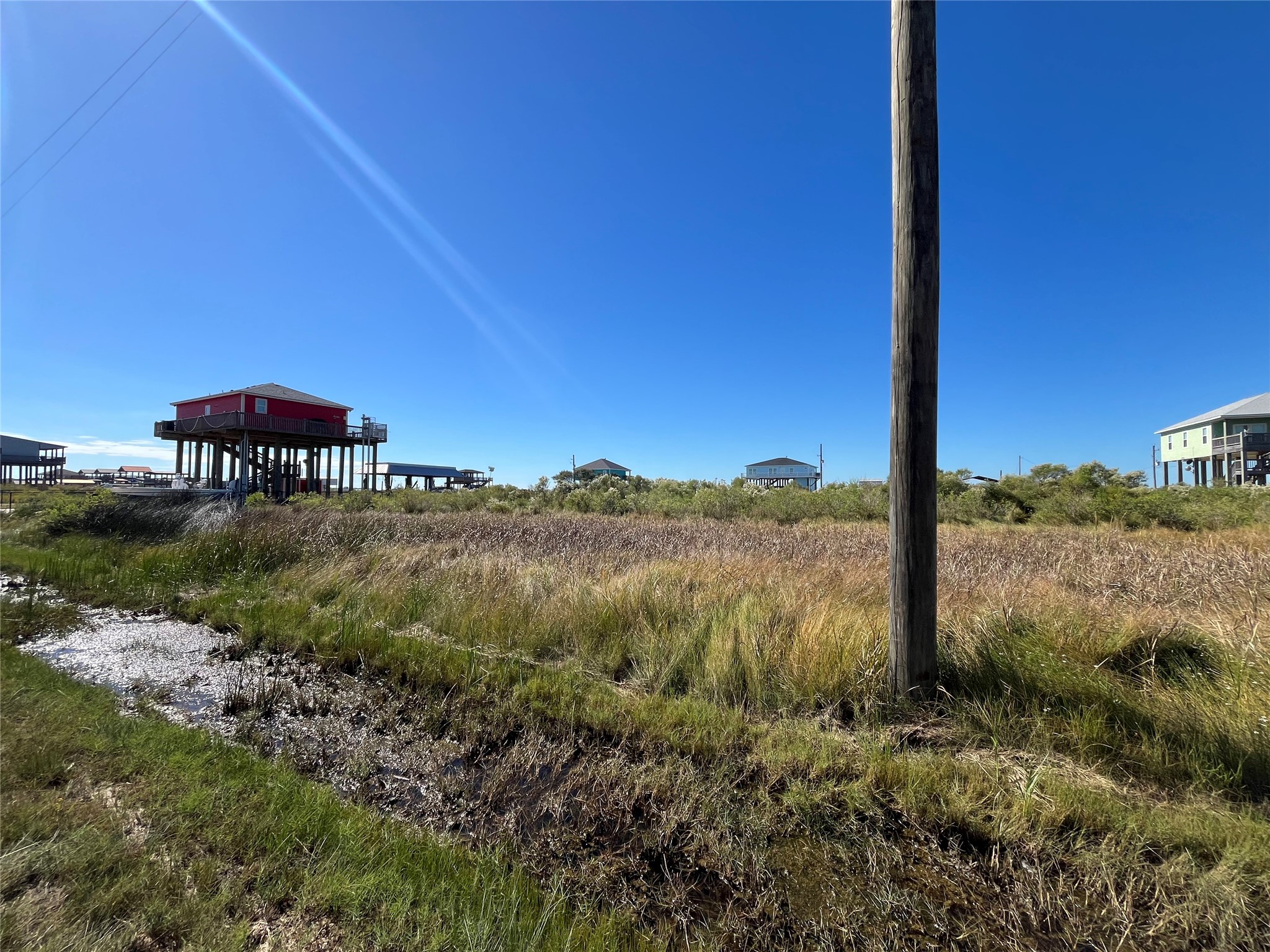 0 Mabry Street Port Bolivar, TX 77650 - Photo 3 of 11 a view of a lake with a mountain in the background