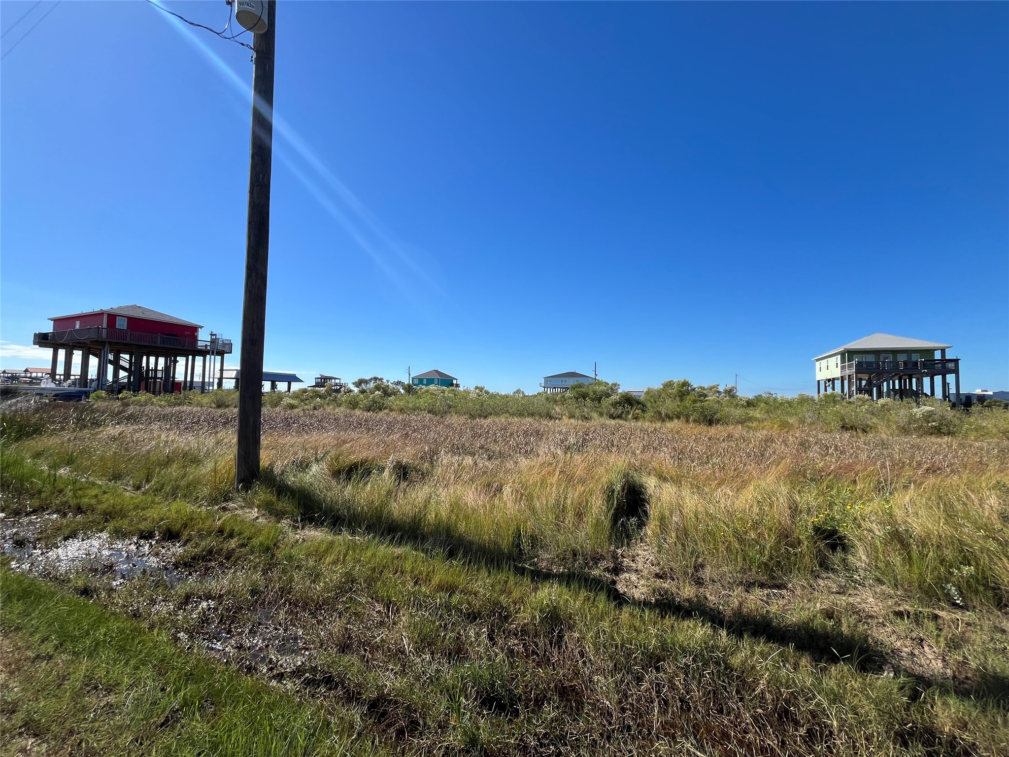 0 Mabry Street Port Bolivar, TX 77650 - Photo 5 of 11 a view of a lake with houses