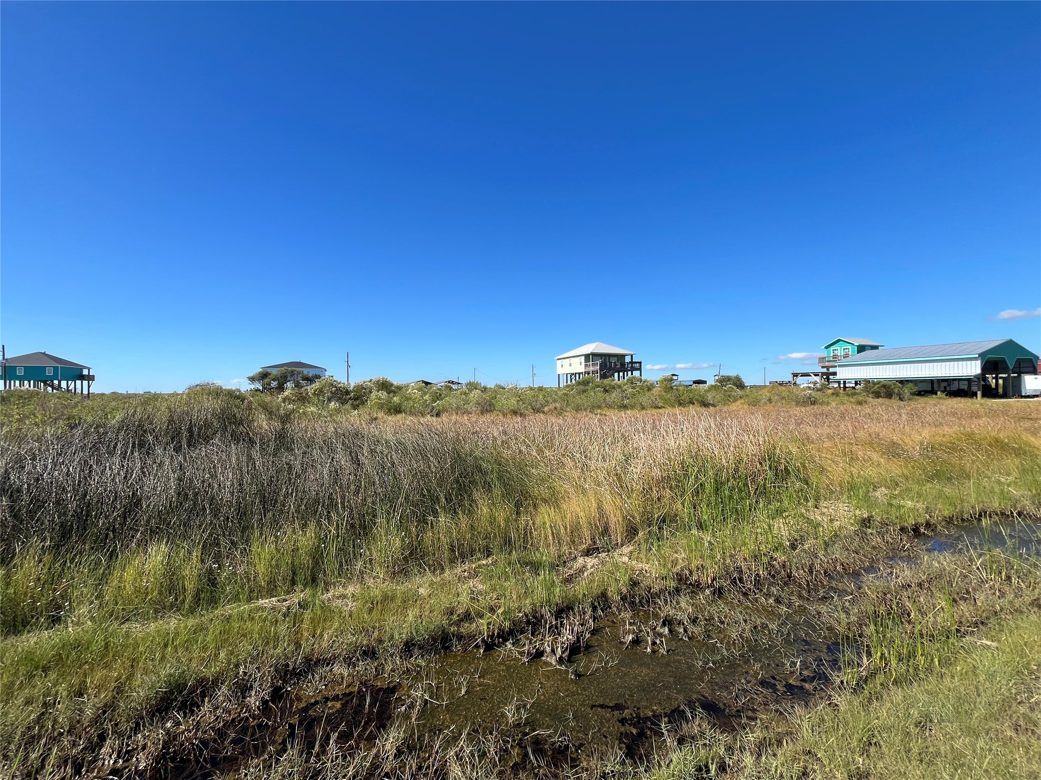 0 Mabry Street Port Bolivar, TX 77650 - Photo 9 of 11 a view of a lake and green valley