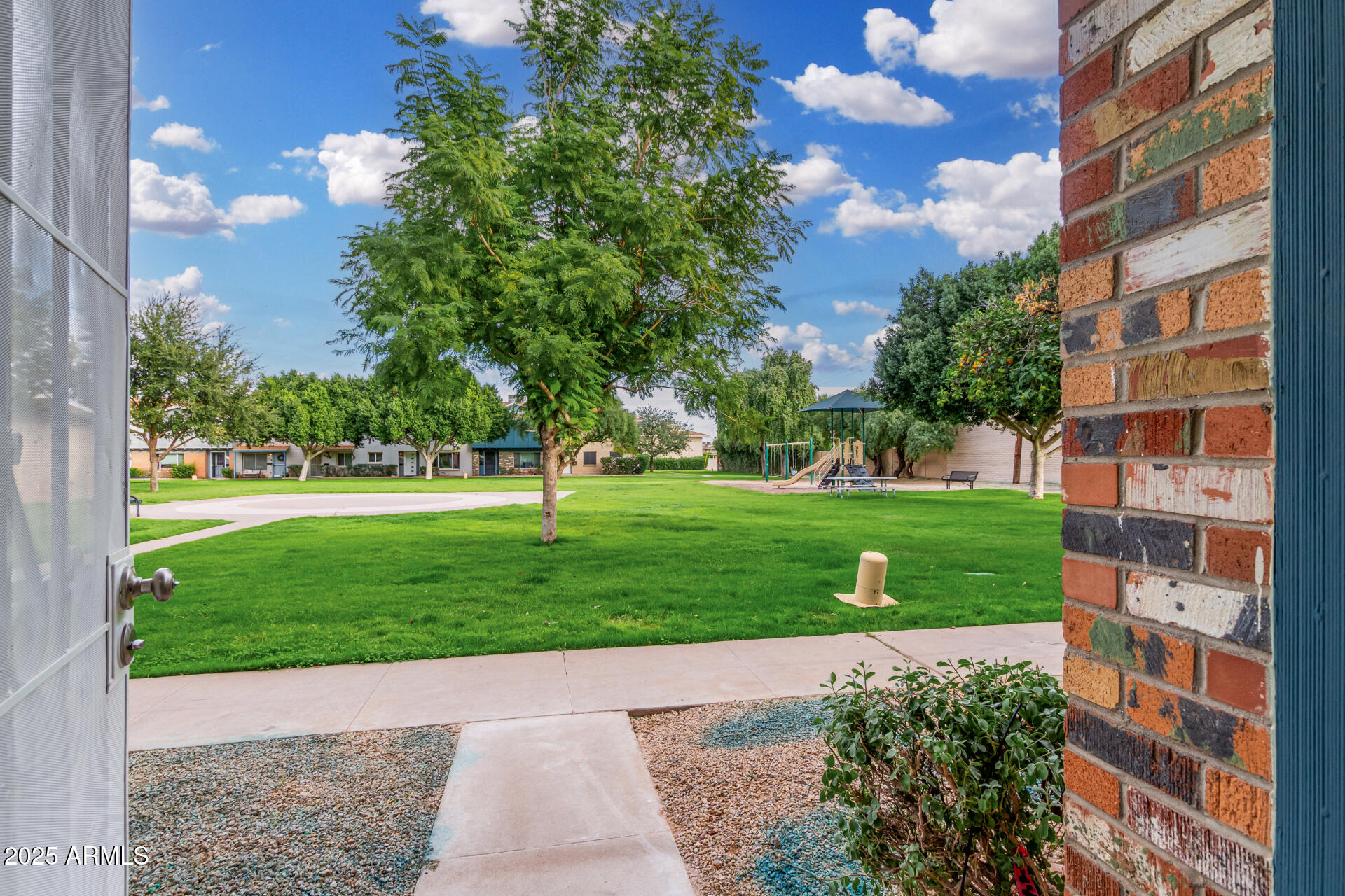 6027 North Granite Reef Road Scottsdale, AZ 85250 - Photo 1 of 29 a view of a garden with a building
