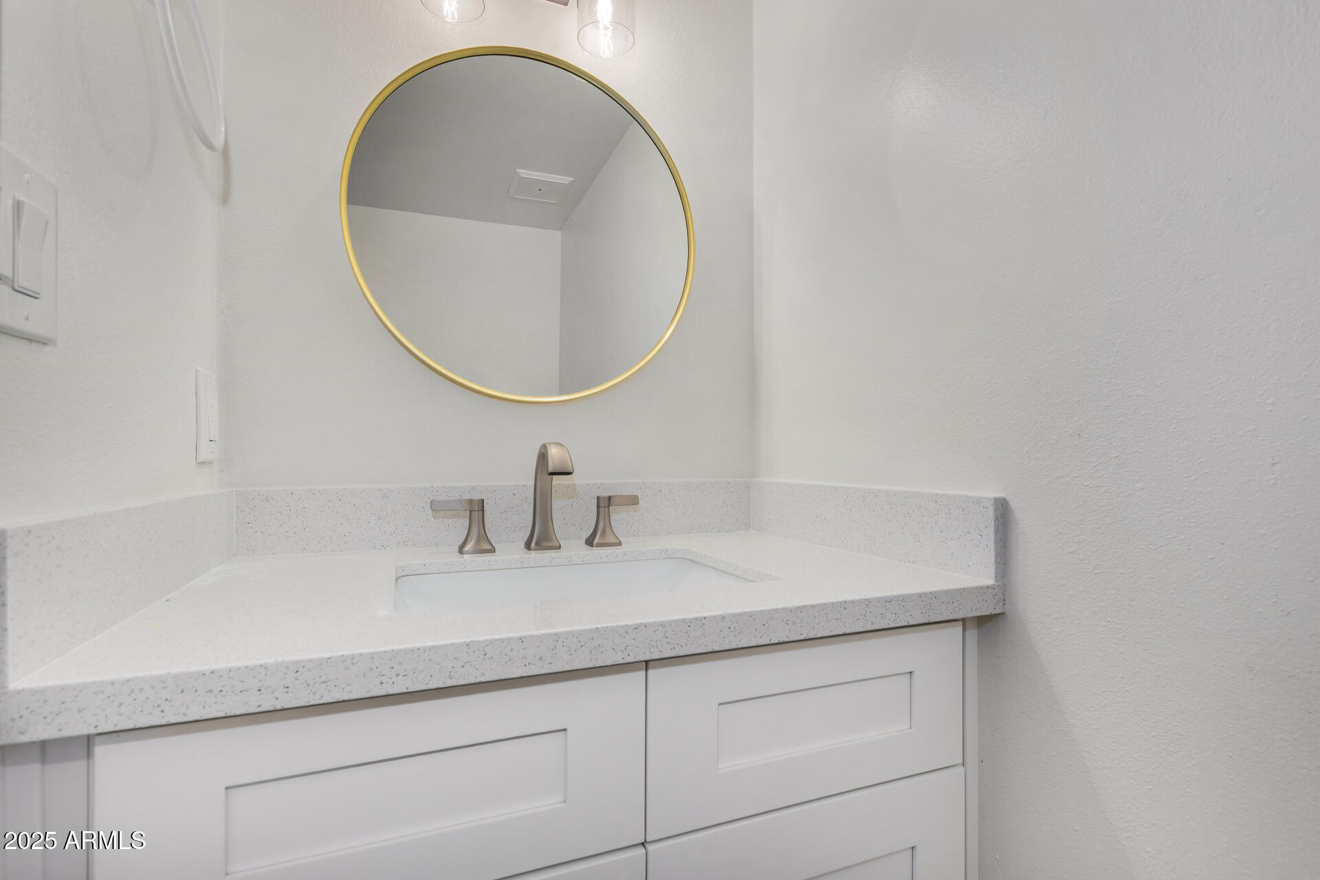 6027 North Granite Reef Road Scottsdale, AZ 85250 - Photo 11 of 29 a bathroom with a sink and a mirror