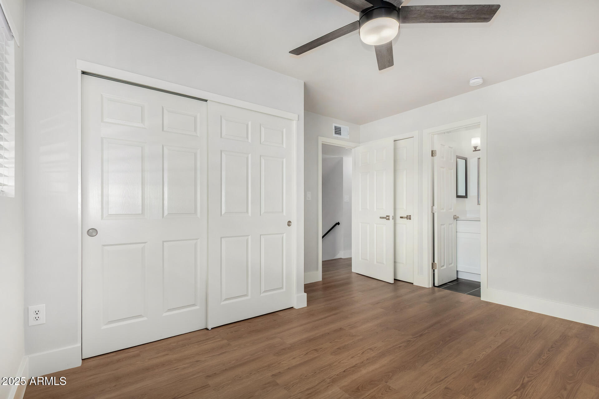 6027 North Granite Reef Road Scottsdale, AZ 85250 - Photo 16 of 29 a view of an empty room and wooden floor