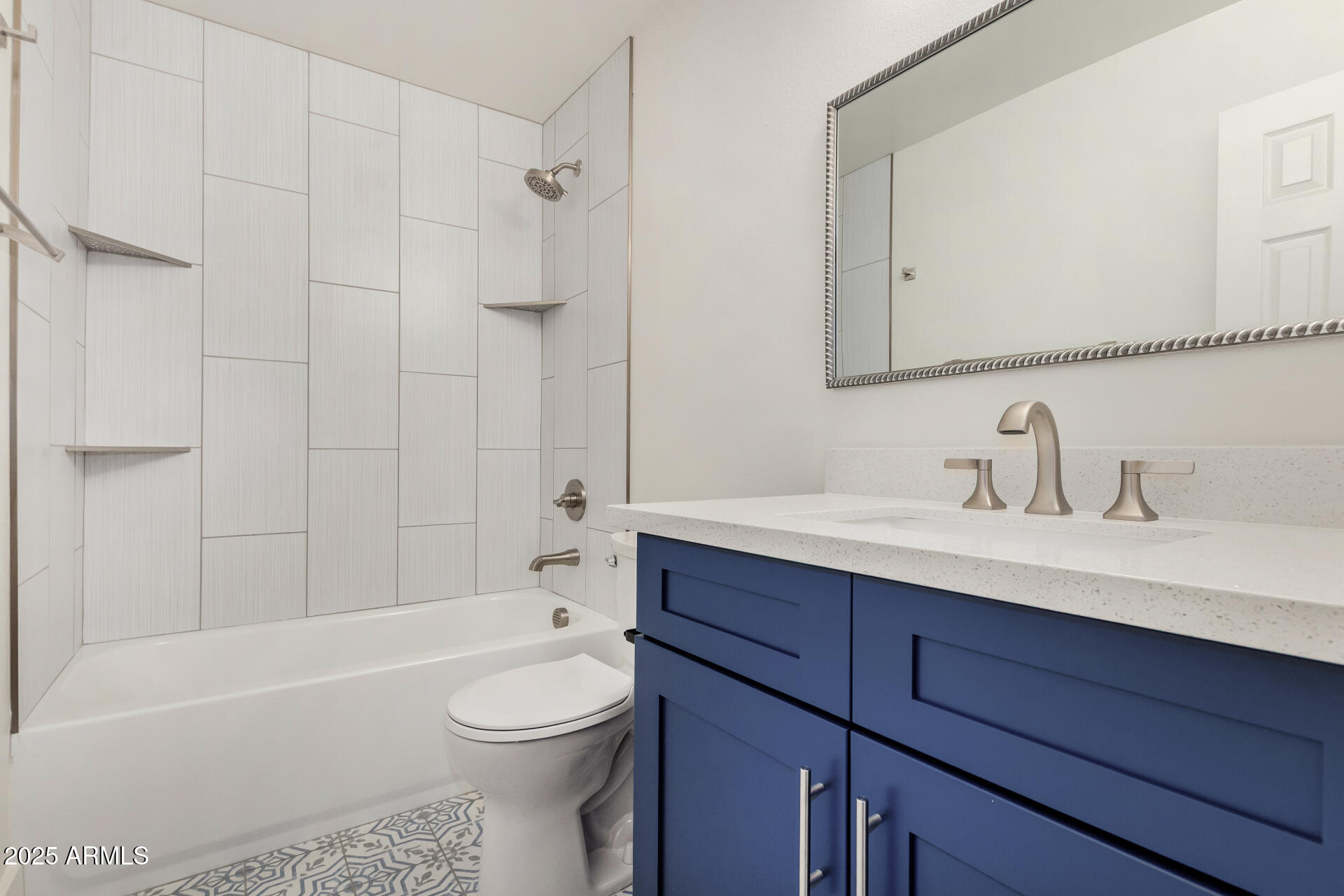6027 North Granite Reef Road Scottsdale, AZ 85250 - Photo 19 of 29 a bathroom with a toilet a sink a mirror a bathtub and shower