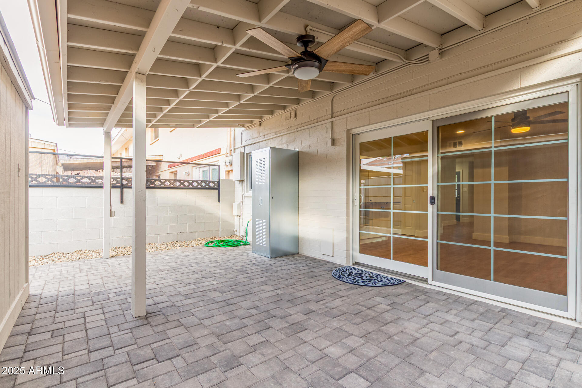 6027 North Granite Reef Road Scottsdale, AZ 85250 - Photo 21 of 29 a view of empty room with wooden floor and fan