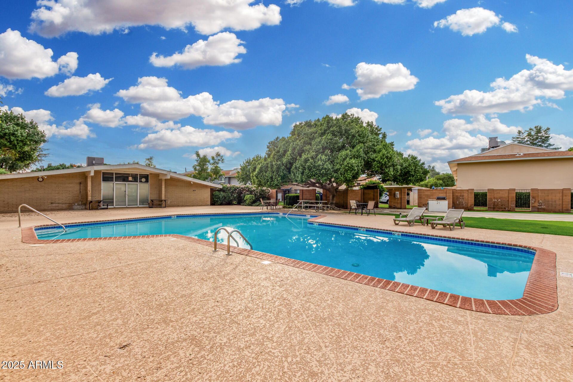 6027 North Granite Reef Road Scottsdale, AZ 85250 - Photo 26 of 29 a swimming pool with outdoor seating and yard