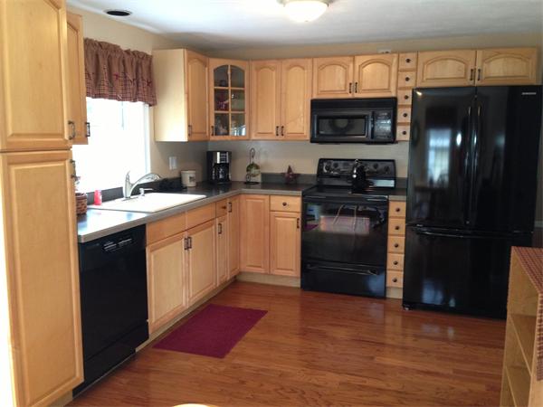 27 Boston Road Sutton, MA 01590 - Photo 5 of 17 a kitchen with a sink stove and refrigerator
