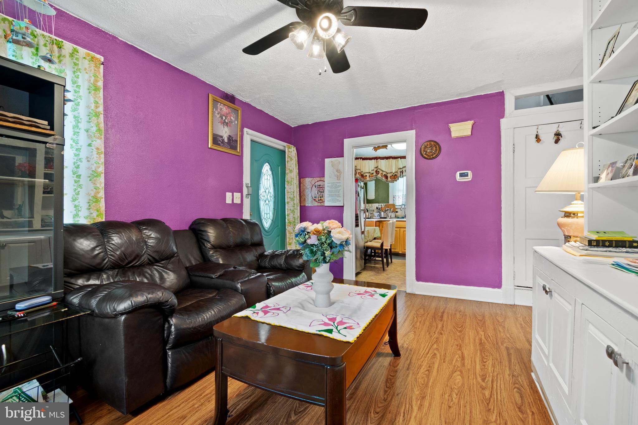 4410 Allies Road Suitland, MD 20746 - Photo 5 of 30 a living room with furniture a rug and a flat screen tv