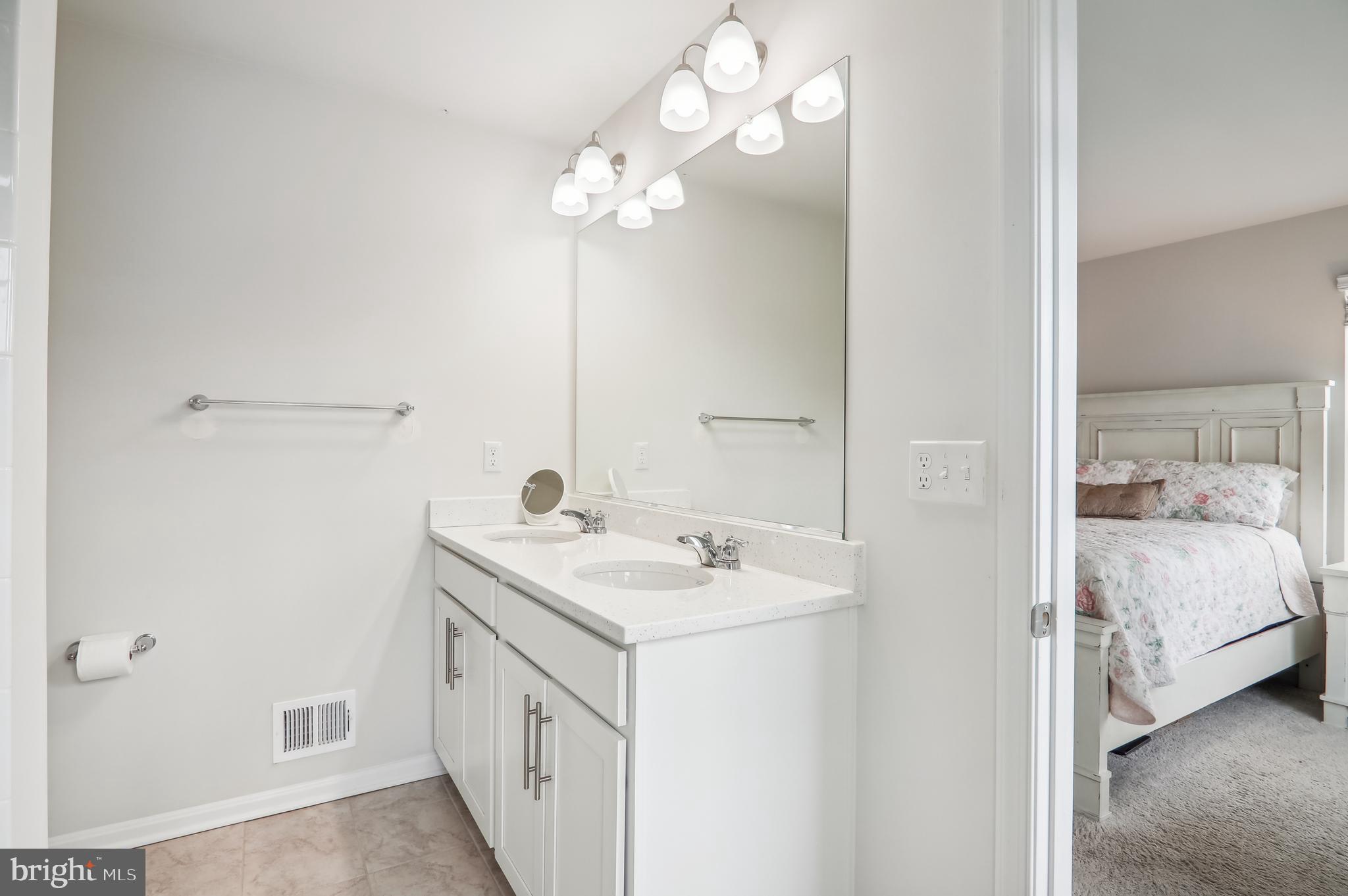9826 Ruby Lockhart Boulevard Bowie, MD 20721 - Photo 13 of 43 Double Sinks in Primary Ensuite. Quartz countertop