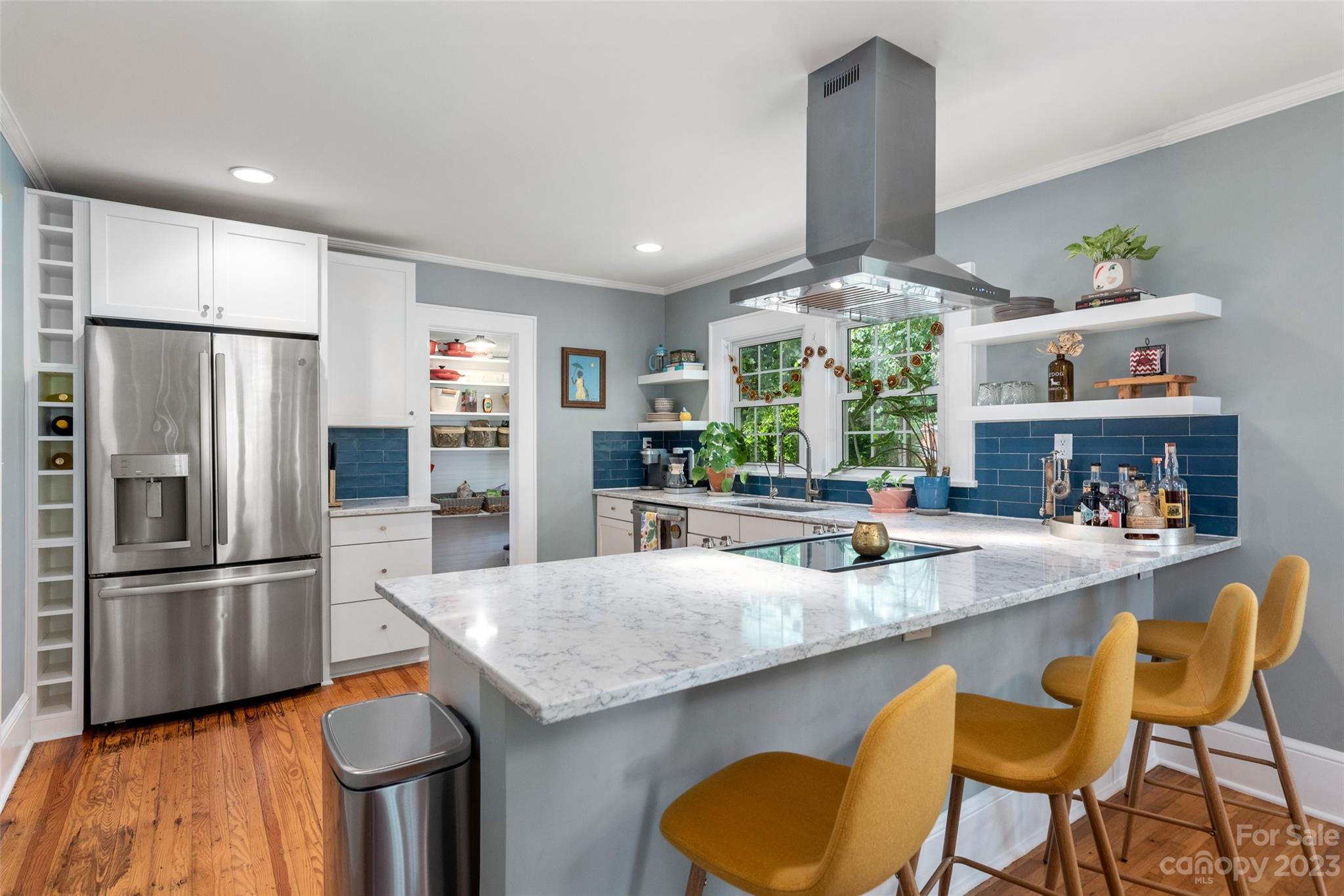 2901 Oakdale Road Charlotte, NC 28216 - Photo 12 of 48 a kitchen with stainless steel appliances granite countertop a table chairs stove and refrigerator