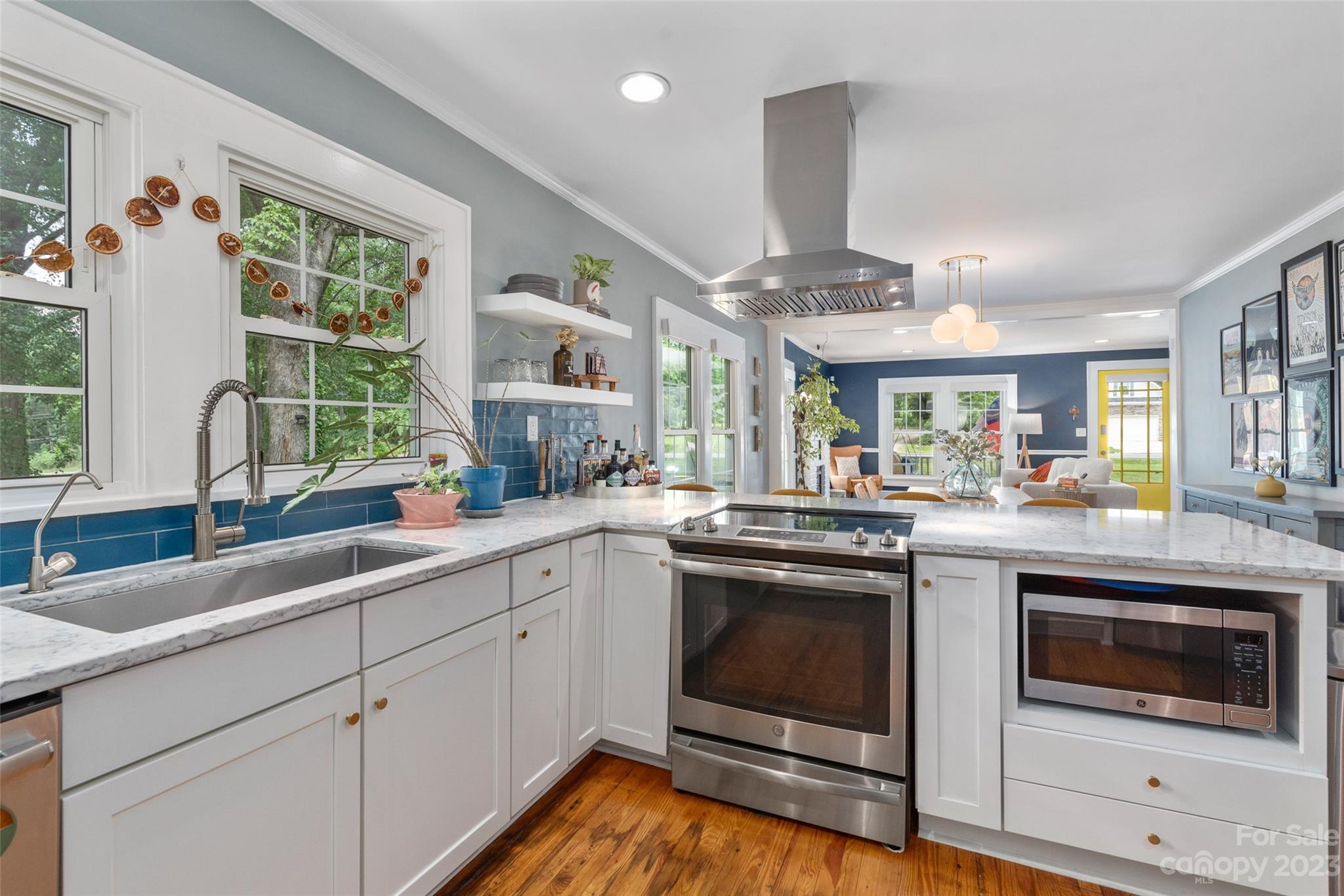 2901 Oakdale Road Charlotte, NC 28216 - Photo 13 of 48 a kitchen with a sink stainless steel appliances and window