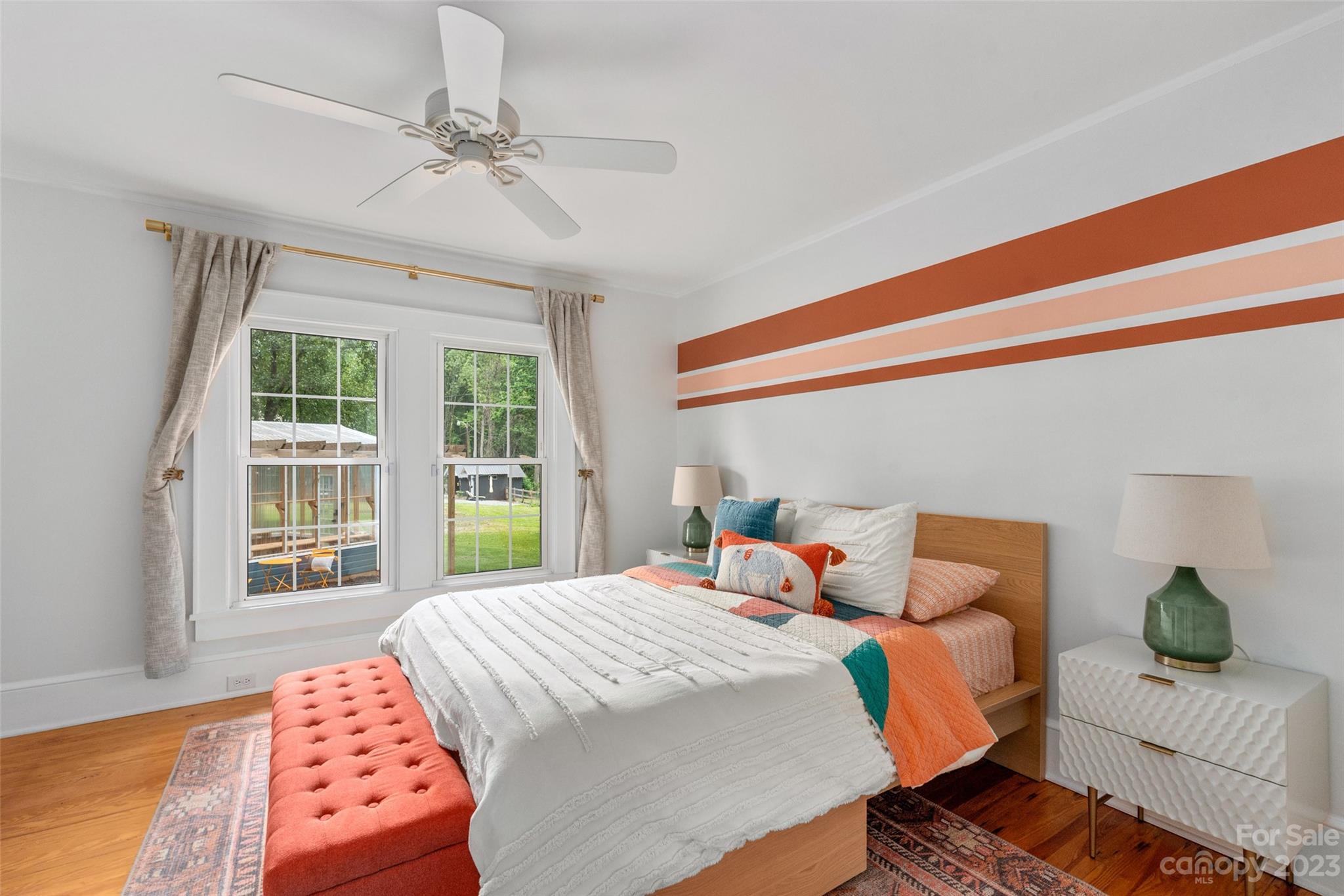 2901 Oakdale Road Charlotte, NC 28216 - Photo 19 of 48 a bedroom with a bed and wooden floor