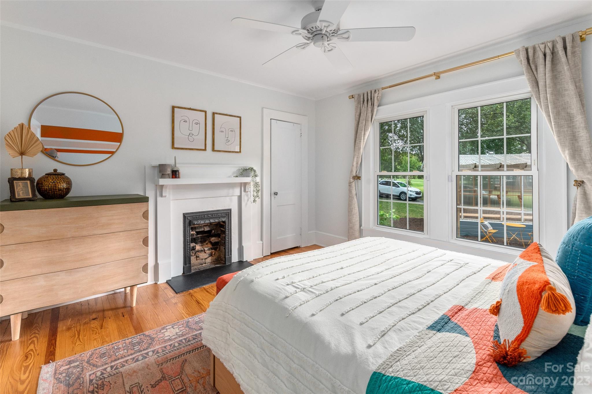 2901 Oakdale Road Charlotte, NC 28216 - Photo 20 of 48 a bedroom with a bed and a fireplace