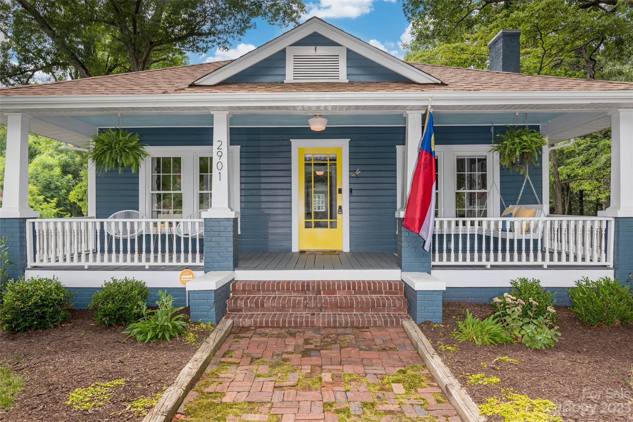 2901 Oakdale Road Charlotte, NC 28216 - Photo 2 of 48 a front view of a house with a porch