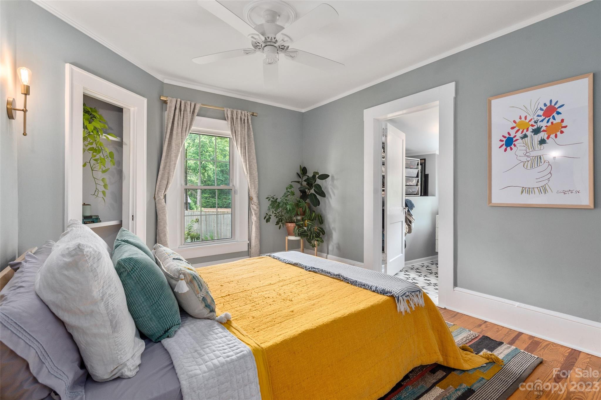 2901 Oakdale Road Charlotte, NC 28216 - Photo 21 of 48 a bed sitting in a bedroom next to a window