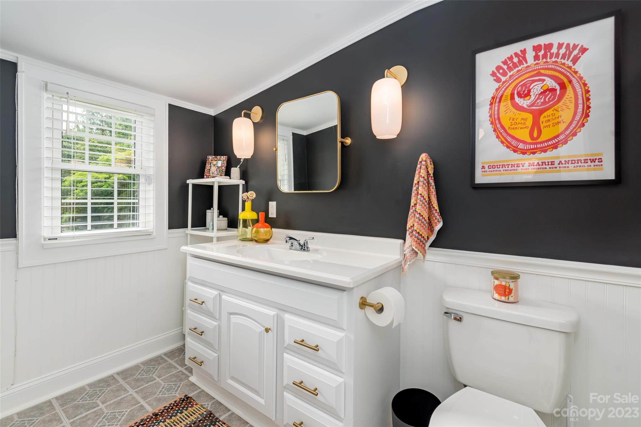 2901 Oakdale Road Charlotte, NC 28216 - Photo 24 of 48 a bathroom with a sink mirror and vanity