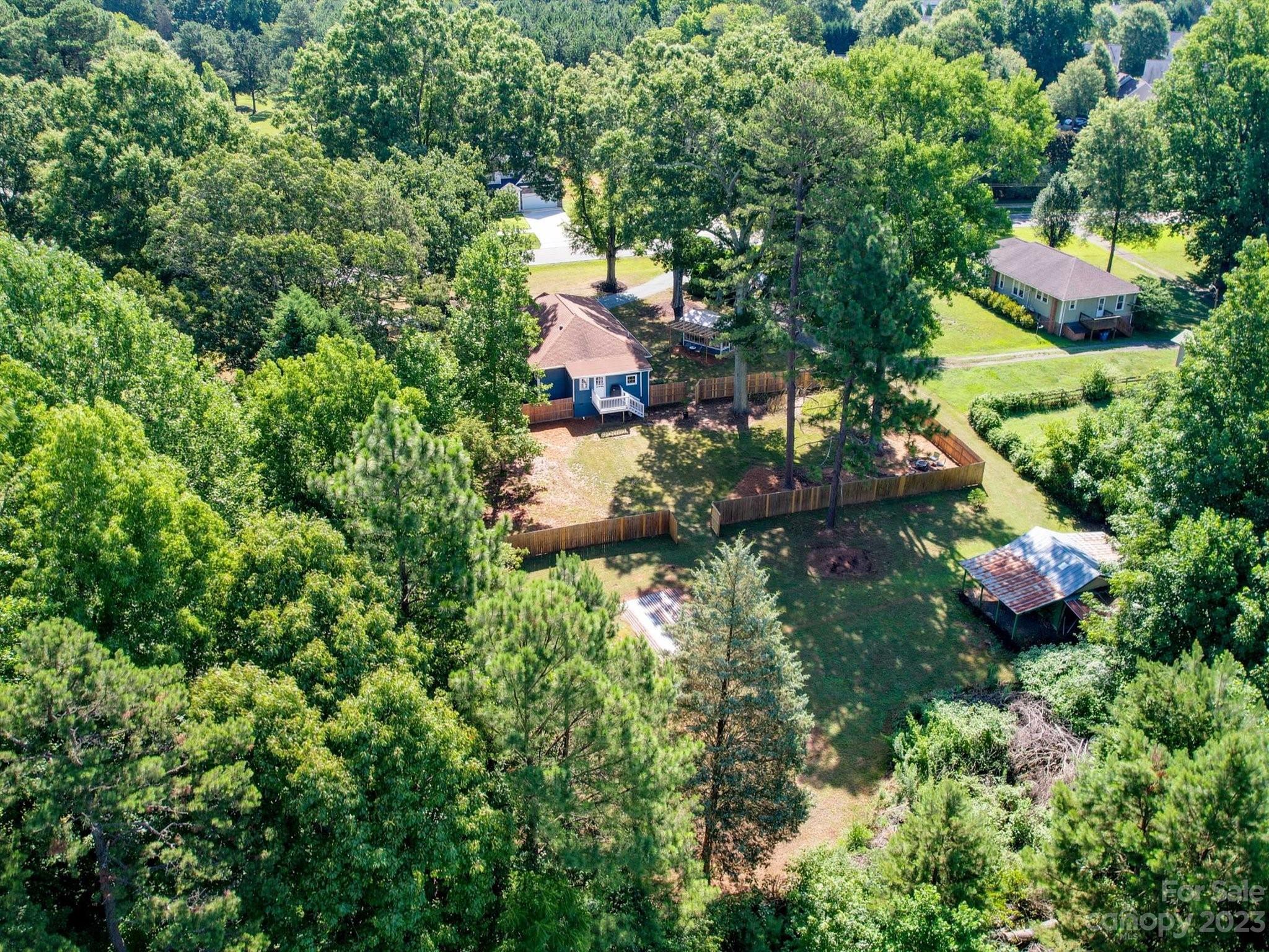 2901 Oakdale Road Charlotte, NC 28216 - Photo 46 of 48 an aerial view of residential house with outdoor space and trees all around
