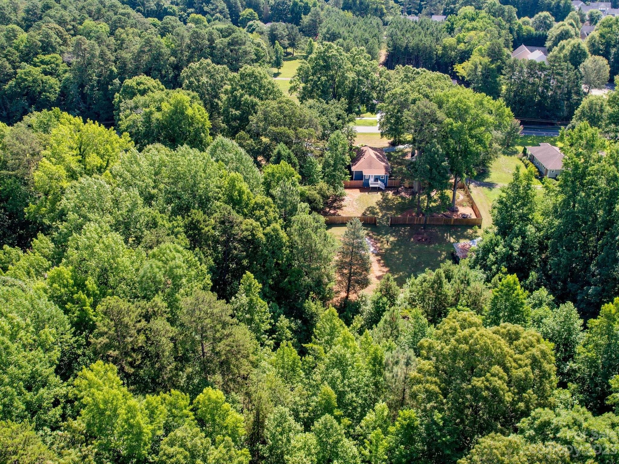 2901 Oakdale Road Charlotte, NC 28216 - Photo 48 of 48 an aerial view of residential house with outdoor space and trees all around
