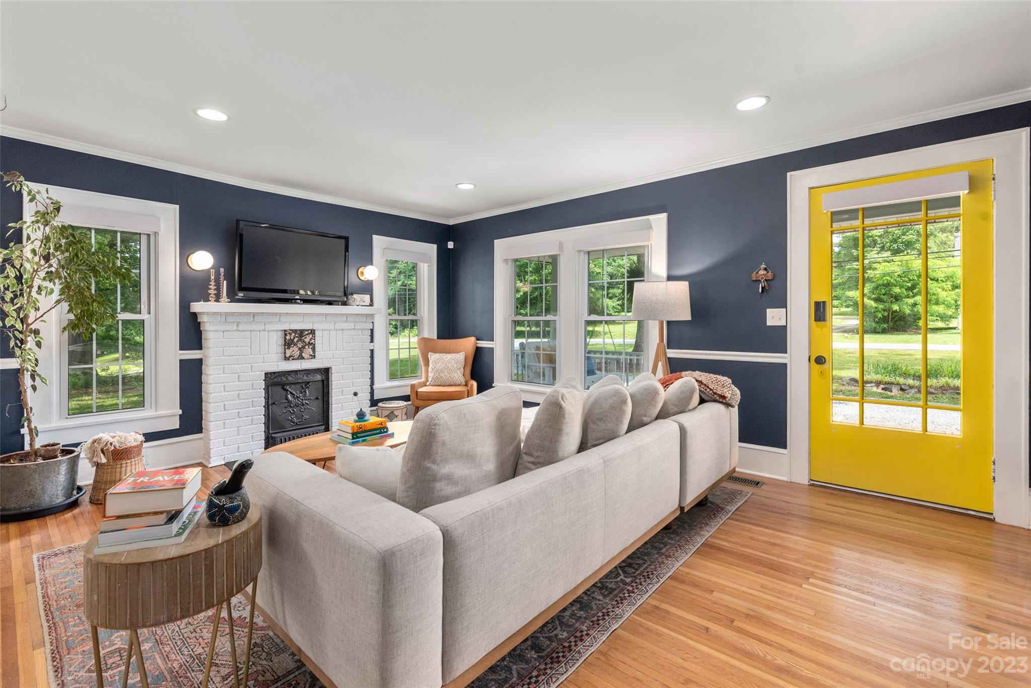 2901 Oakdale Road Charlotte, NC 28216 - Photo 6 of 48 a living room with fireplace furniture and a large window