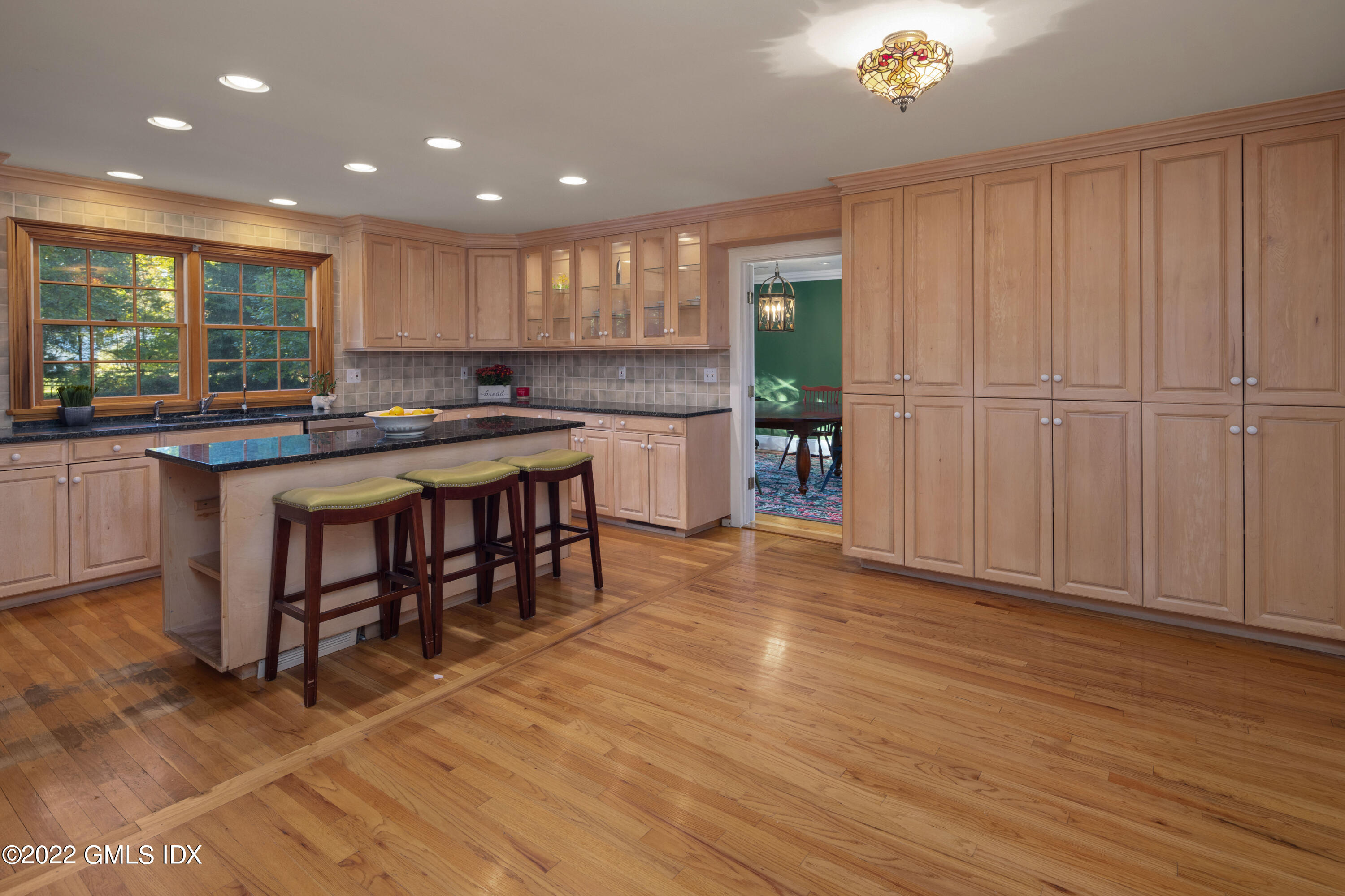 42 Angus Lane Greenwich, CT 06831 - Photo 13 of 39 a kitchen with a sink cabinets and wooden floor