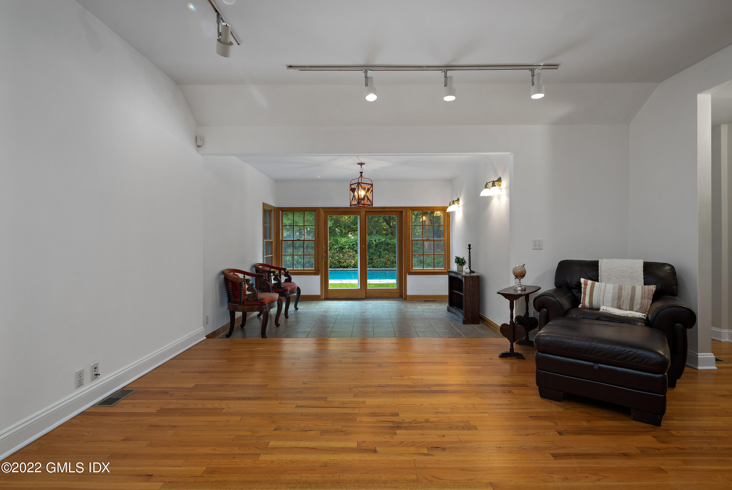 42 Angus Lane Greenwich, CT 06831 - Photo 15 of 39 a living room with furniture and a large window