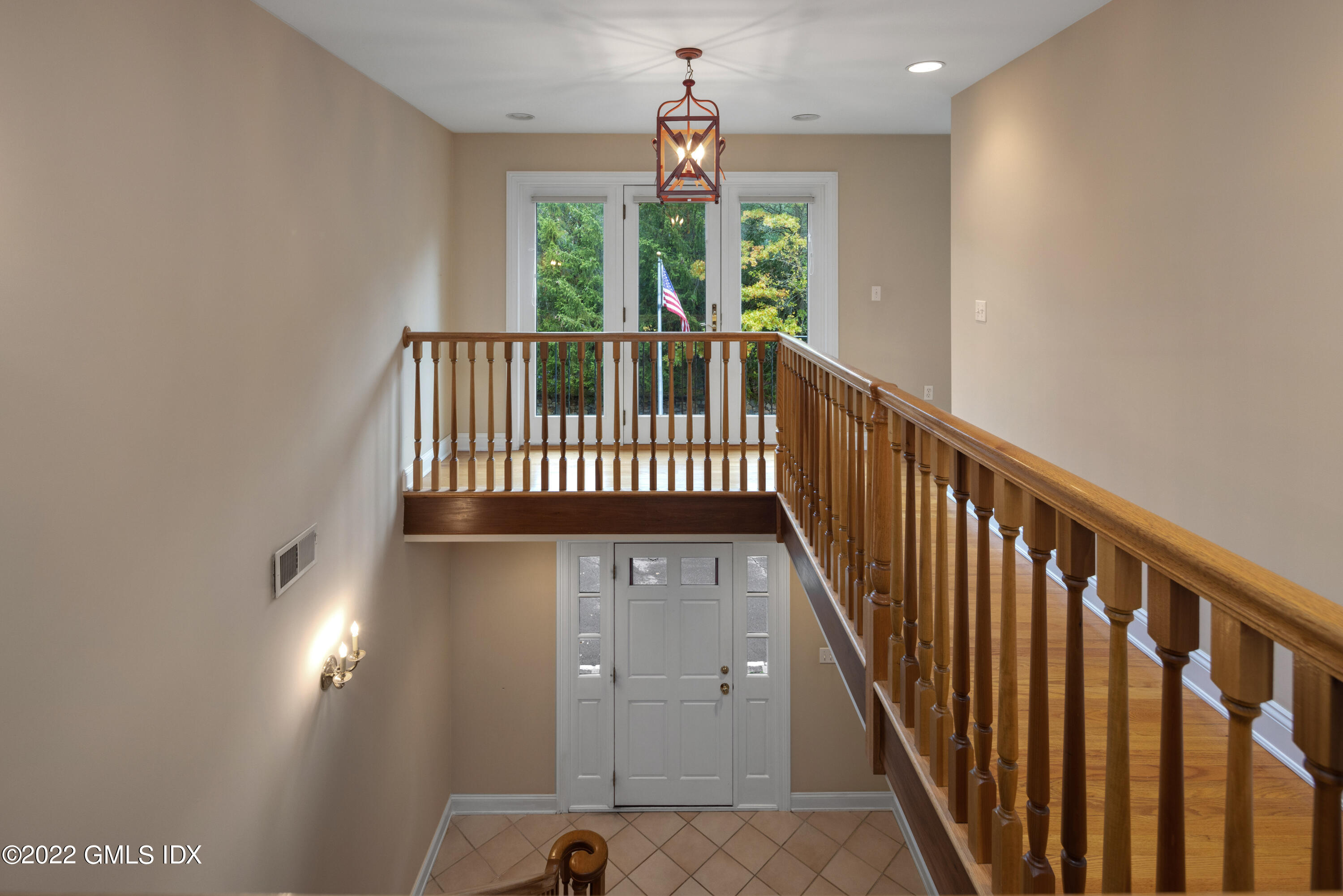 42 Angus Lane Greenwich, CT 06831 - Photo 22 of 39 a view of a hallway with windows
