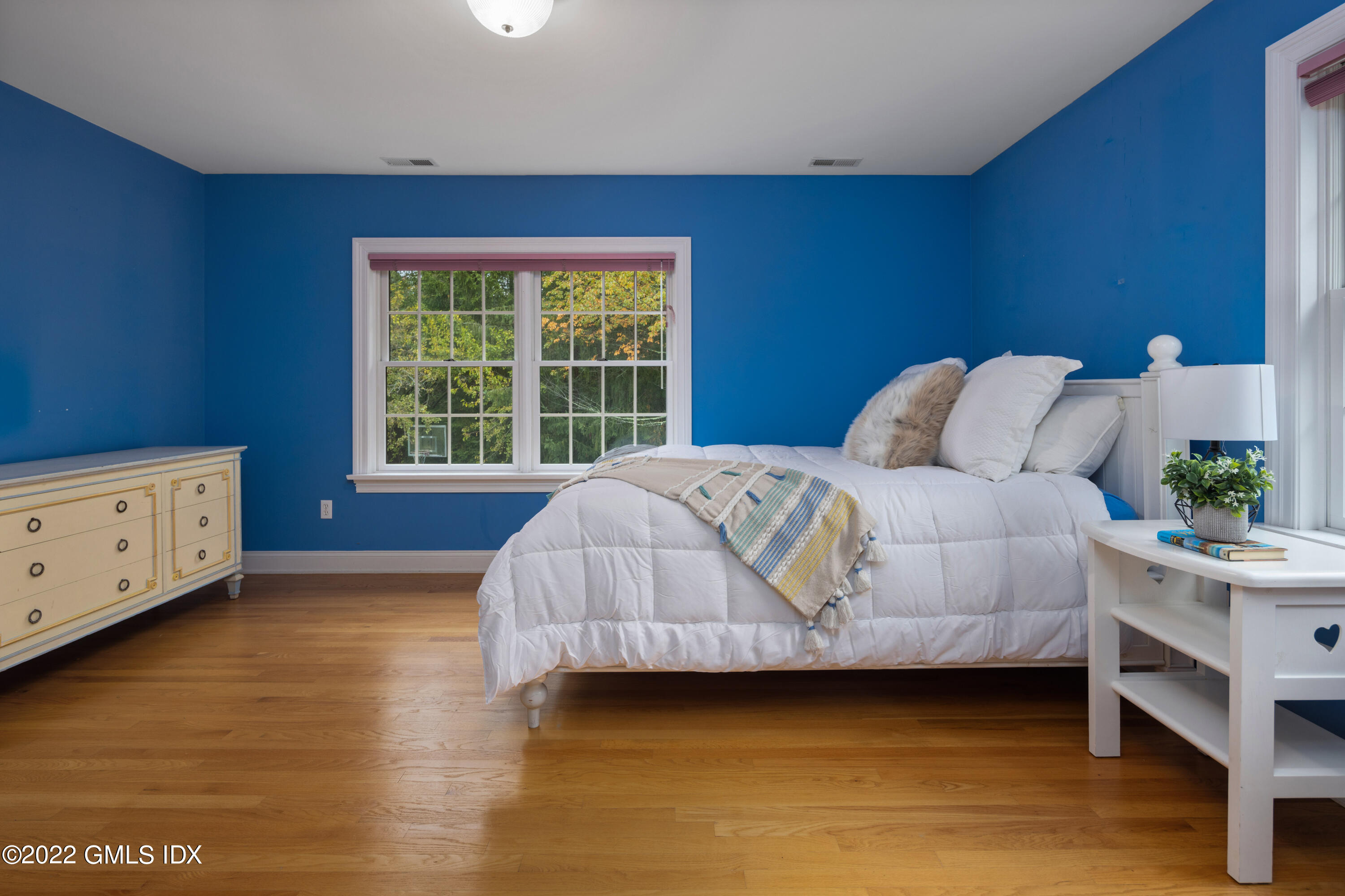 42 Angus Lane Greenwich, CT 06831 - Photo 28 of 39 a bedroom with a bed and a window