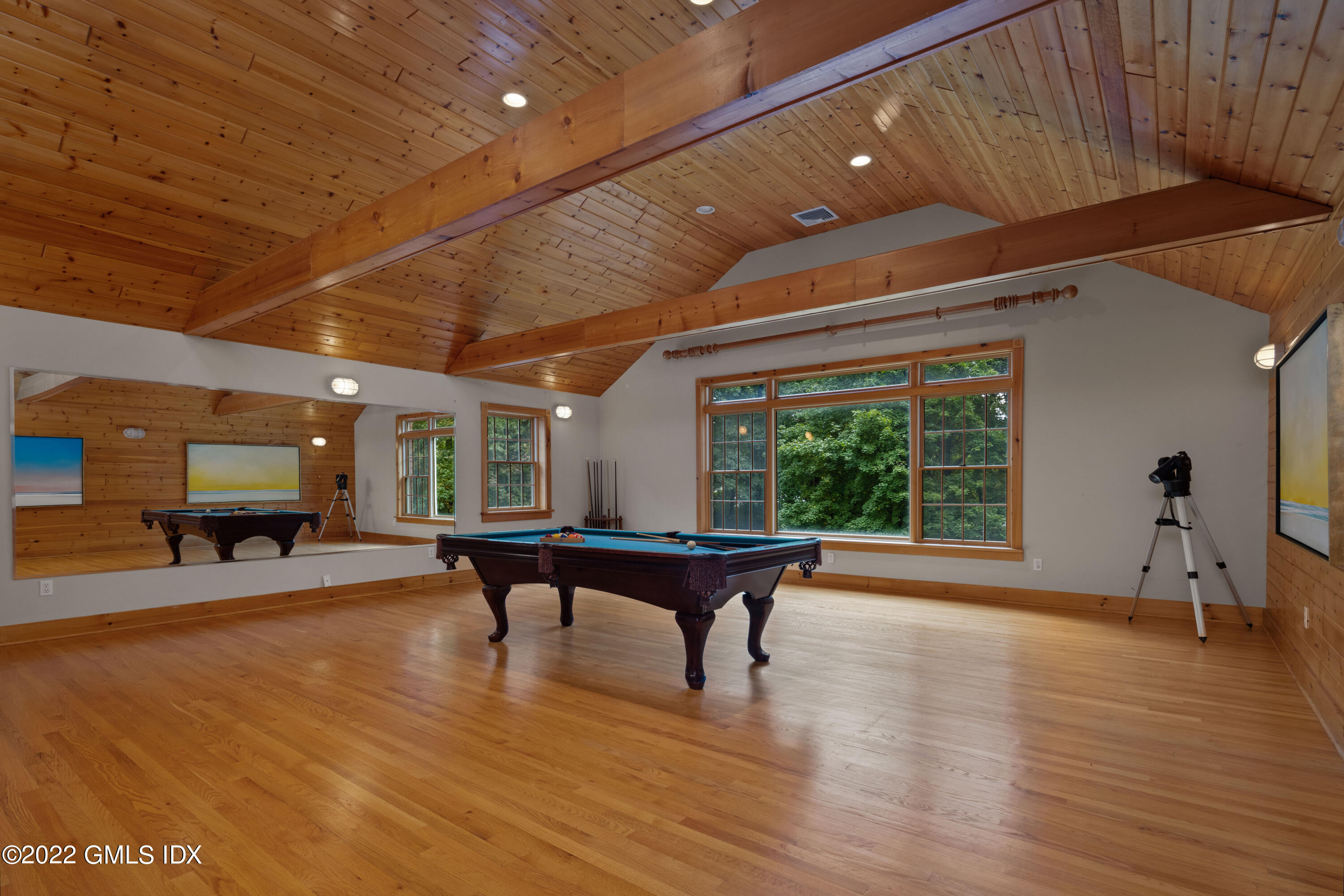 42 Angus Lane Greenwich, CT 06831 - Photo 31 of 39 a living room with furniture a wooden floor and a large window