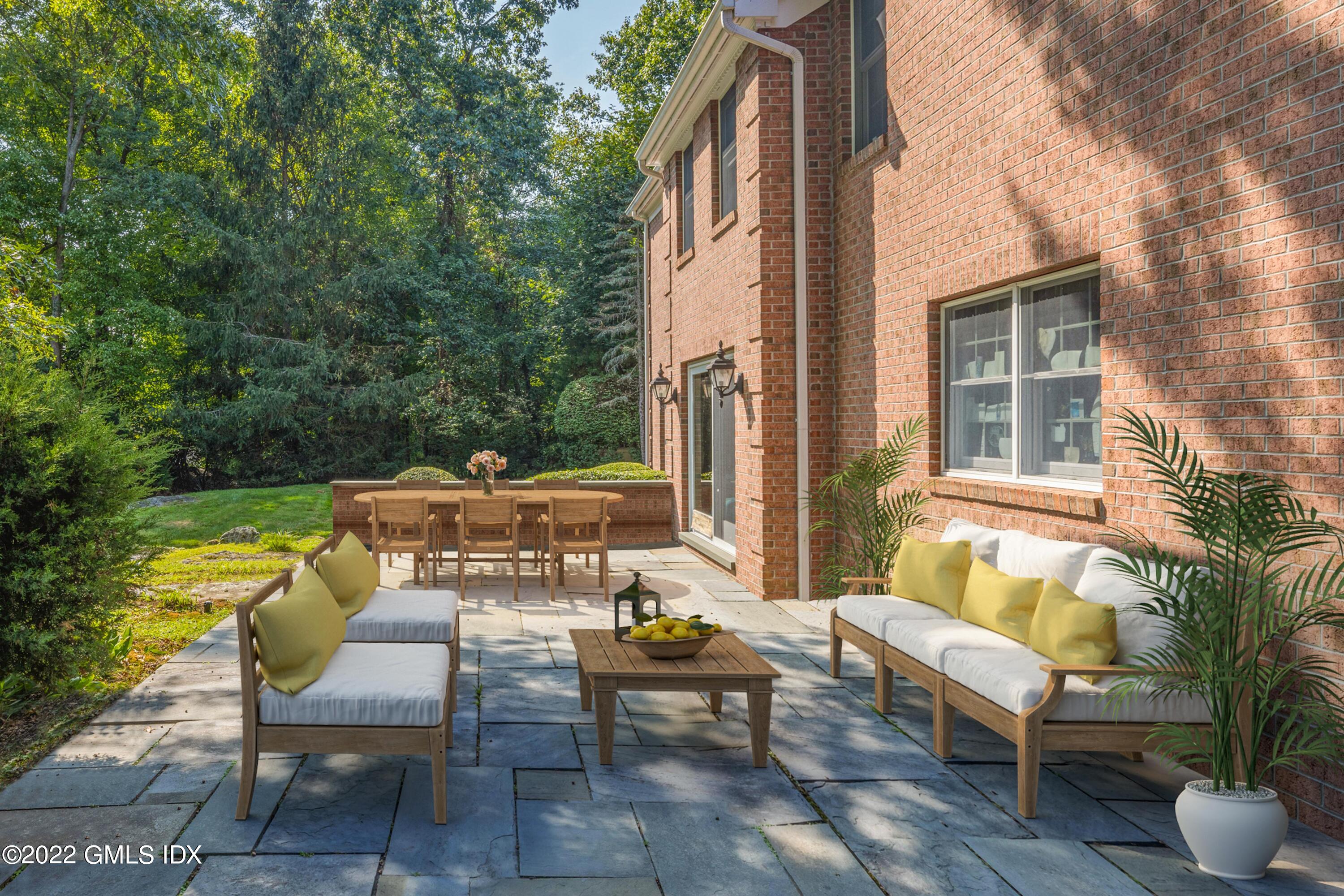 42 Angus Lane Greenwich, CT 06831 - Photo 33 of 39 a backyard of a house with outdoor seating