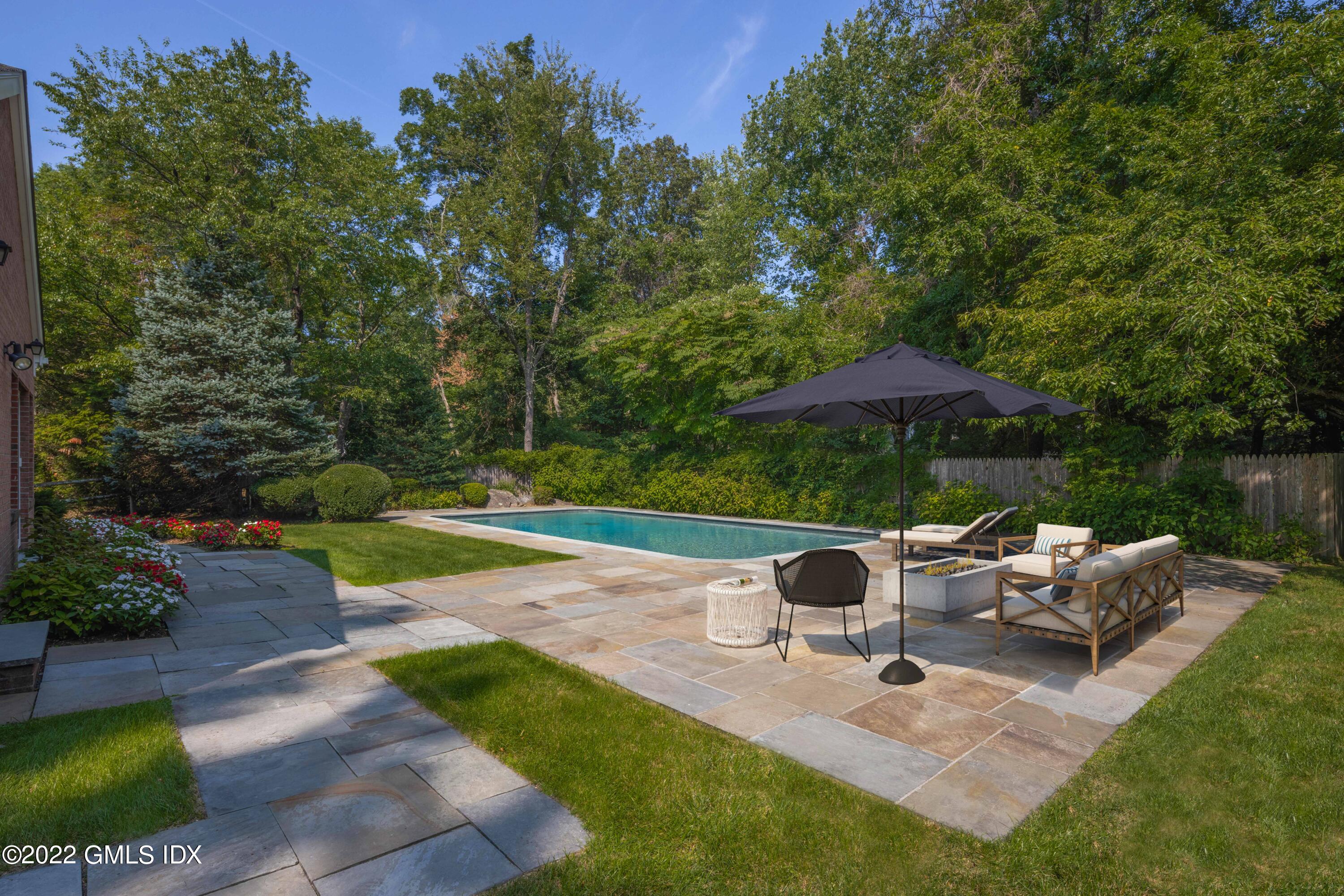 42 Angus Lane Greenwich, CT 06831 - Photo 34 of 39 a view of backyard with outdoor seating and trees