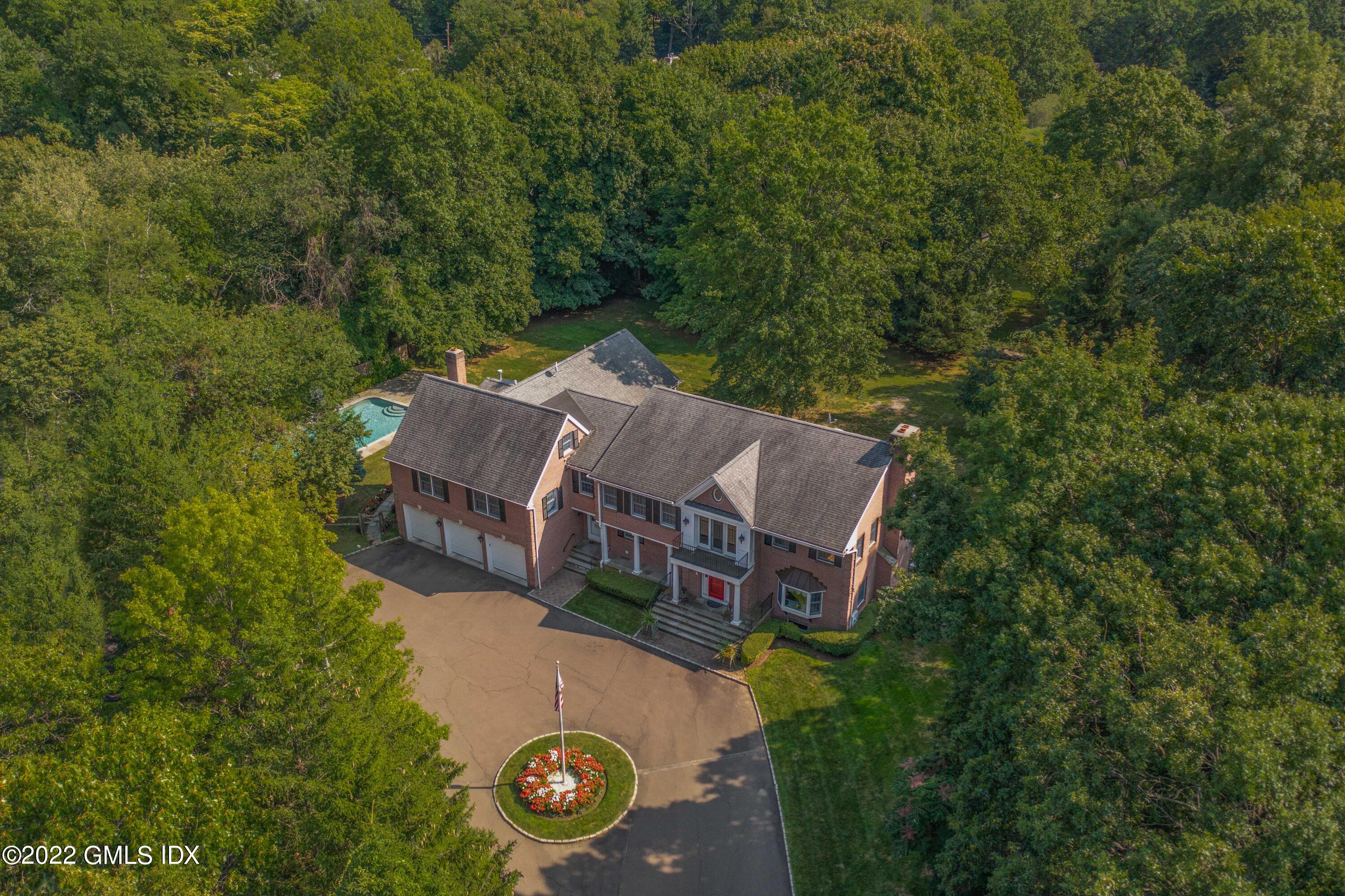 42 Angus Lane Greenwich, CT 06831 - Photo 4 of 39 an aerial view of a house with yard swimming pool and outdoor seating