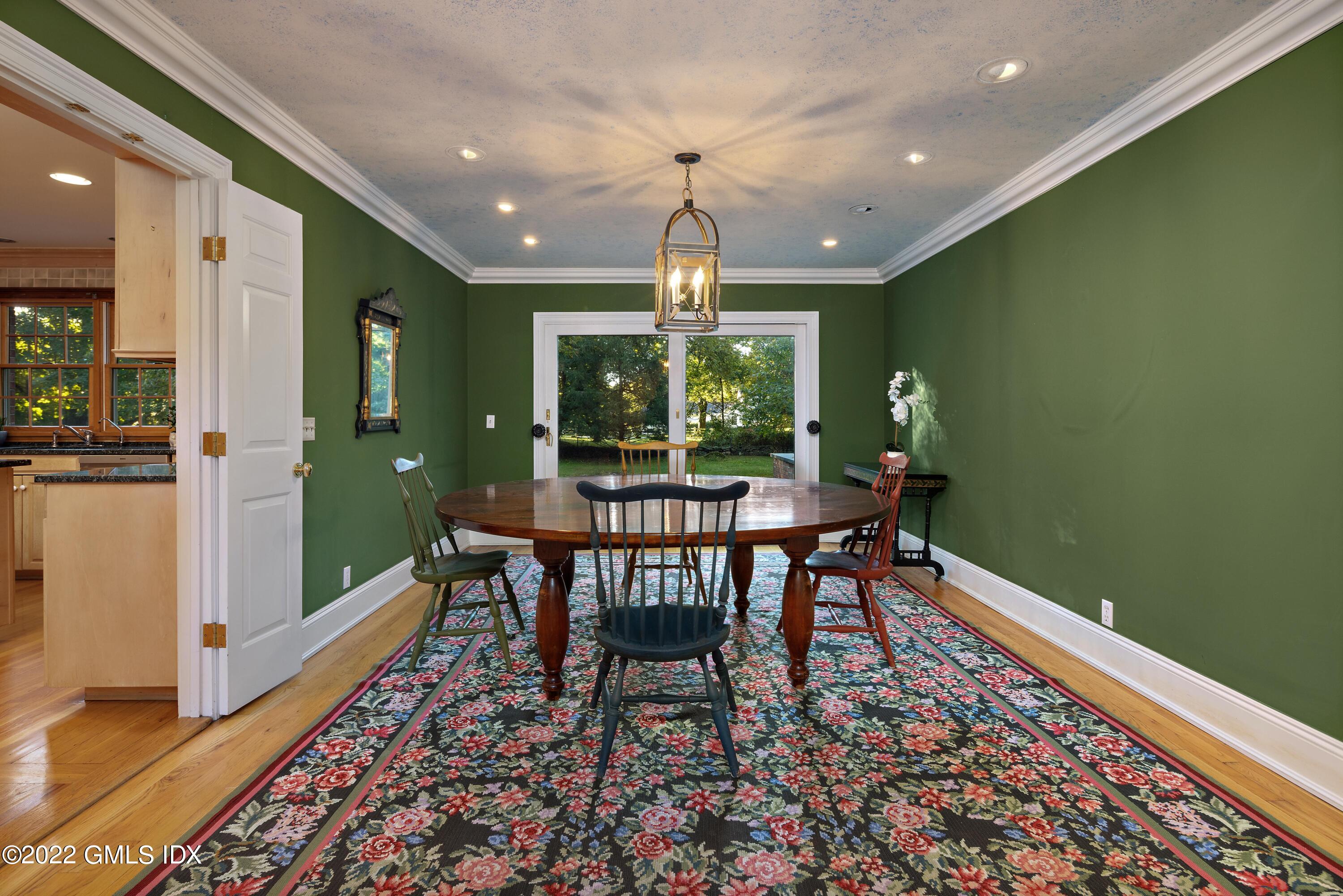 42 Angus Lane Greenwich, CT 06831 - Photo 7 of 39 a view of a dining room with furniture window and wooden floor