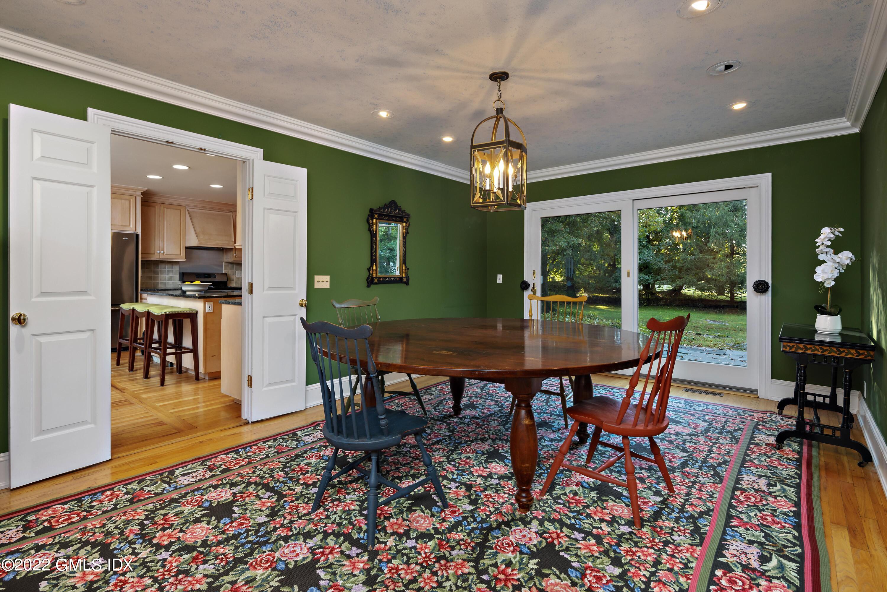 42 Angus Lane Greenwich, CT 06831 - Photo 8 of 39 a view of a dining room with furniture window and wooden floor