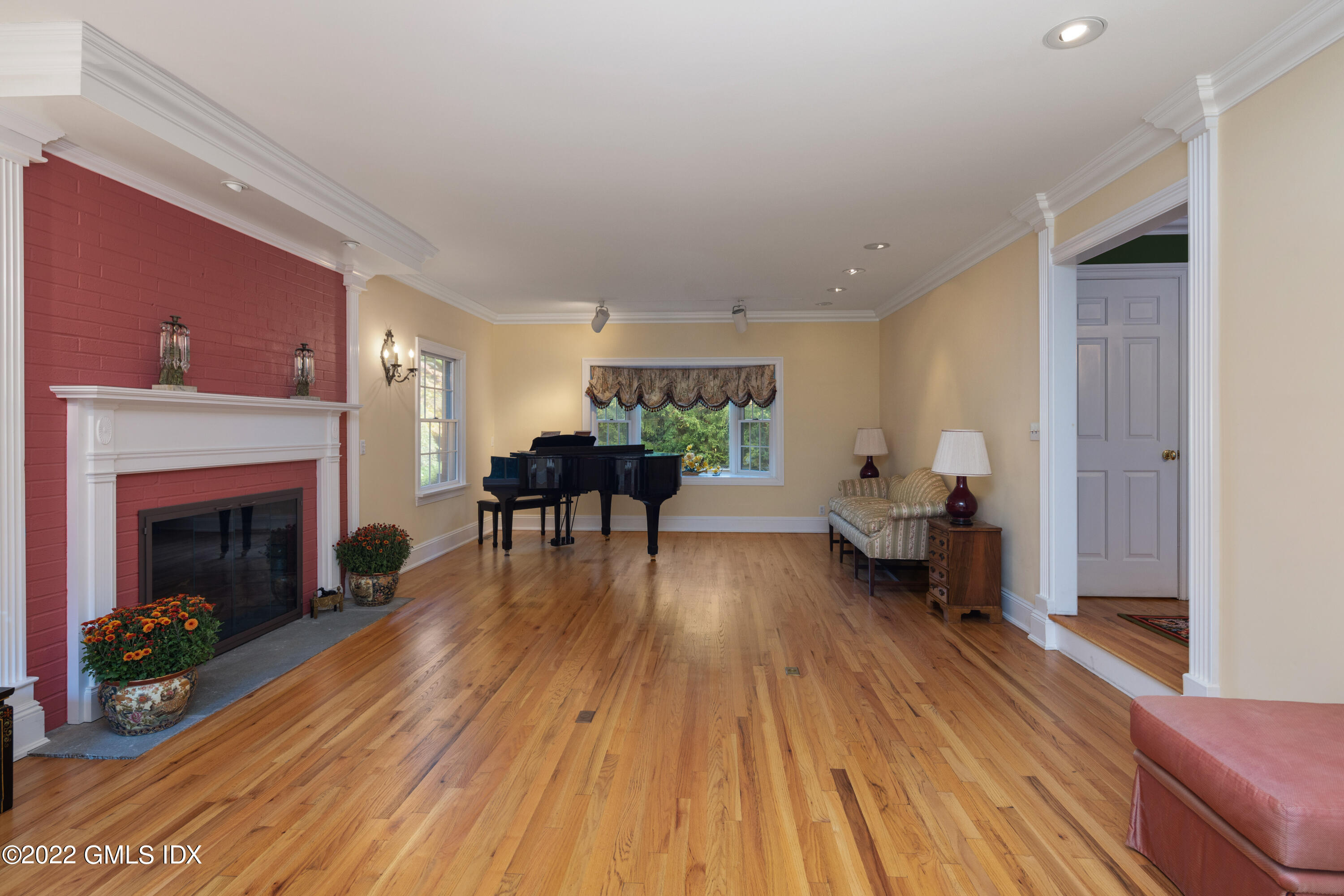 42 Angus Lane Greenwich, CT 06831 - Photo 10 of 39 a living room with furniture and a fireplace