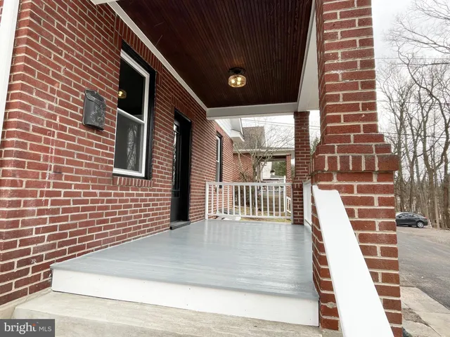 a view of a balcony with wooden floor