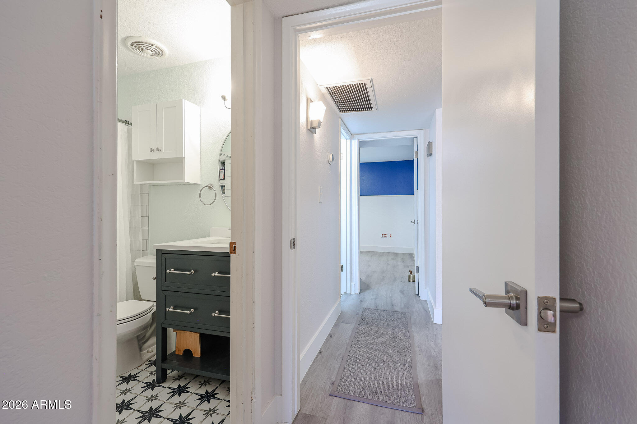 5114 East Monte Vista Road Phoenix, AZ 85008 - Photo 16 of 45 a bathroom with a sink and mirror