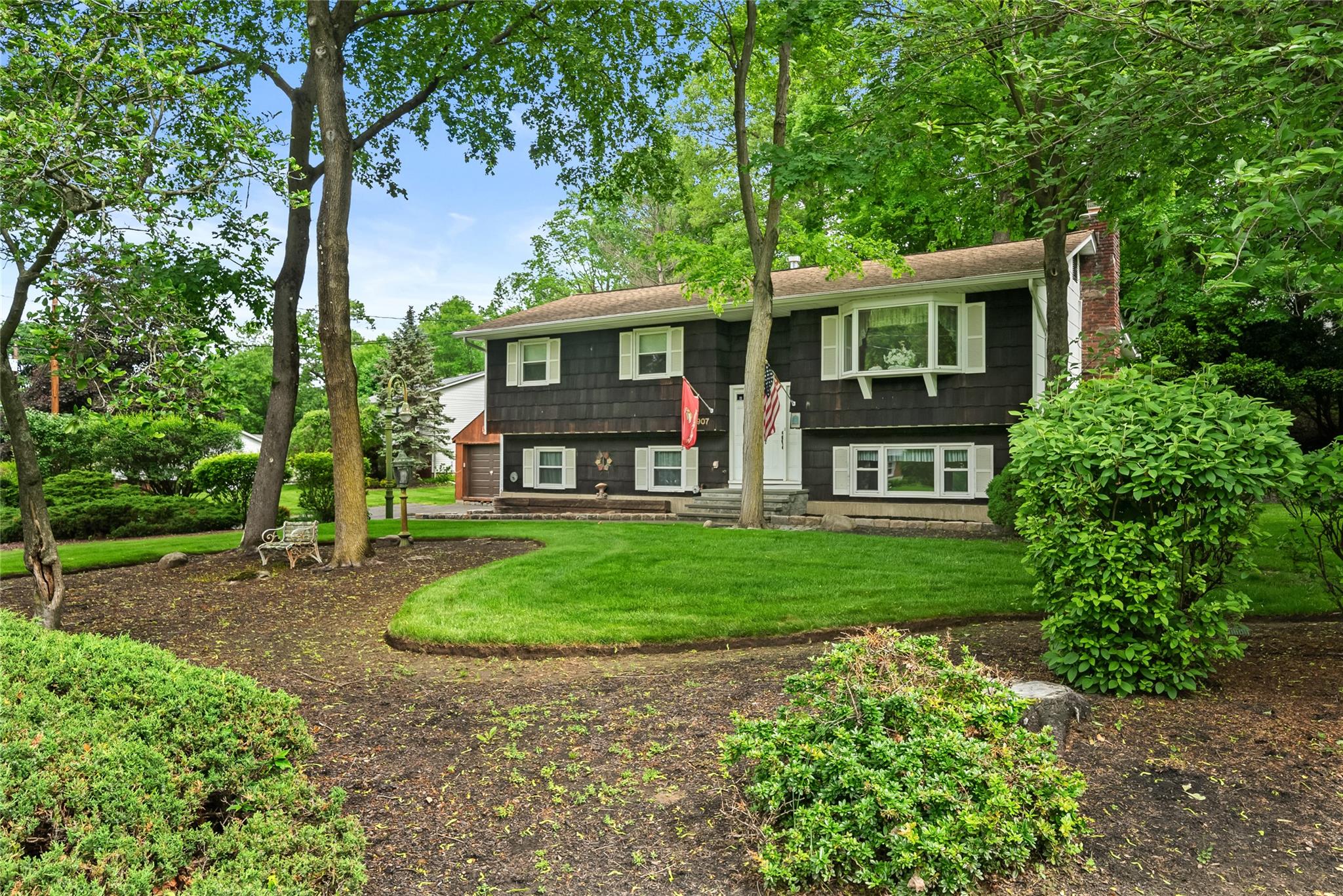 907 Stockton Road Valley Cottage, NY 10989 - Photo 1 of 1 Raised ranch with a chimney, a front lawn, and entry steps