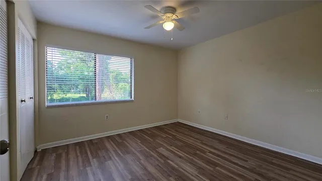 a view of a bathroom with wooden floor and a sink