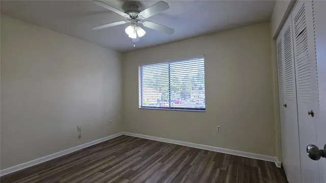 wooden floor in an empty room with a gallery