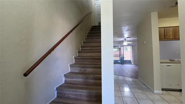 a view of entryway and hall with wooden floor