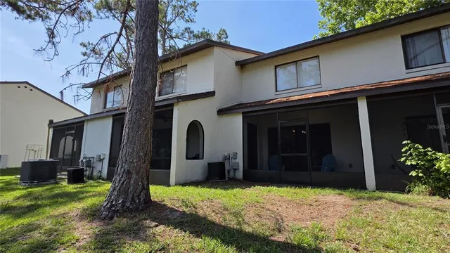 a backyard of a house with lots of green space