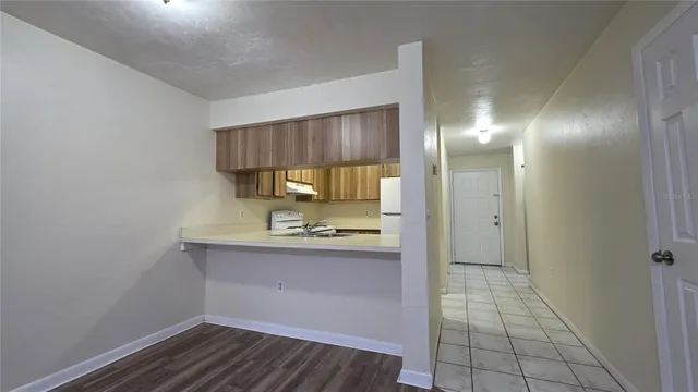 a view of a kitchen from the hallway