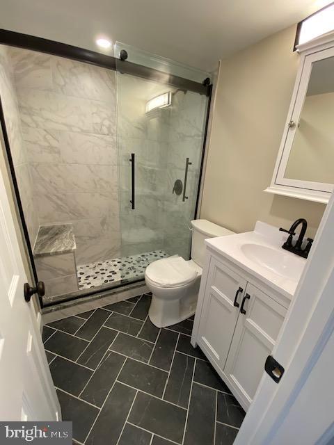2101-17 Chestnut Street, Unit 215 Philadelphia, PA 19103 - Photo 4 of 10 a bathroom with a sink toilet and shower