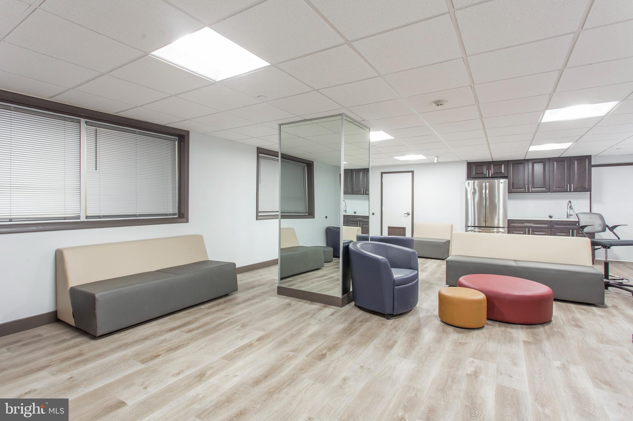 2101-17 Chestnut Street, Unit 215 Philadelphia, PA 19103 - Photo 7 of 10 a living room with furniture and a couch