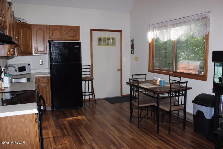 1295 Brookfield Road Lake Ariel, PA 18436 - Photo 8 of 26 a view of a dining room with furniture window and wooden floor