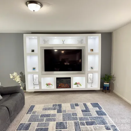 a living room with a couch and a flat screen tv