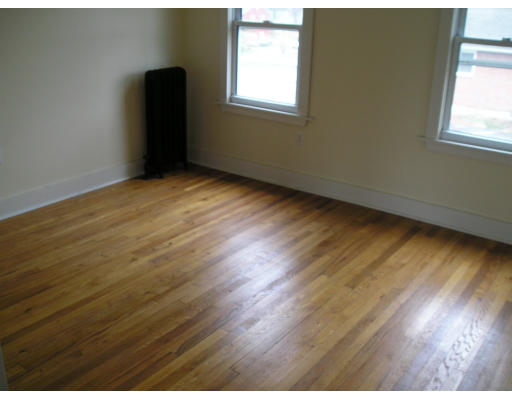 1996 Westfield Street West Springfield, MA 01089 - Photo 9 of 15 an empty room with wooden floor and windows
