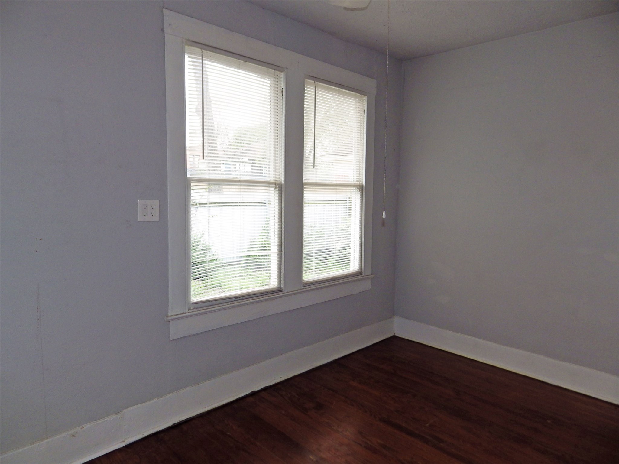 4322 Wilmer Street Houston, TX 77003 - Photo 15 of 31 a view of an empty room with wooden floor and a window