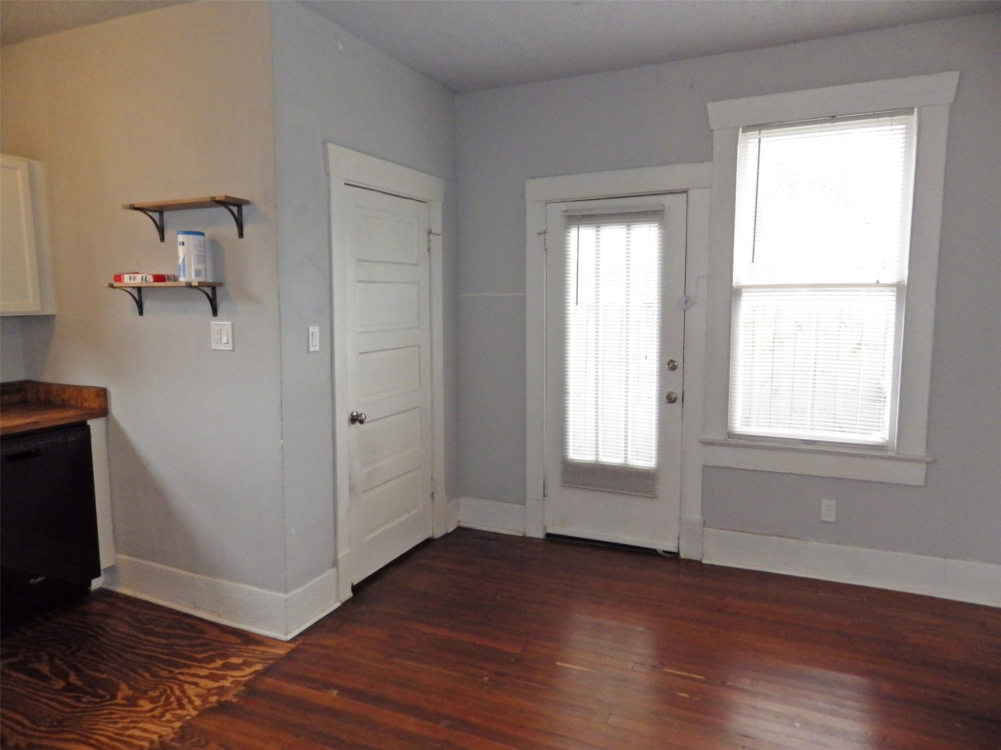 4322 Wilmer Street Houston, TX 77003 - Photo 17 of 31 an empty room with wooden floor and windows