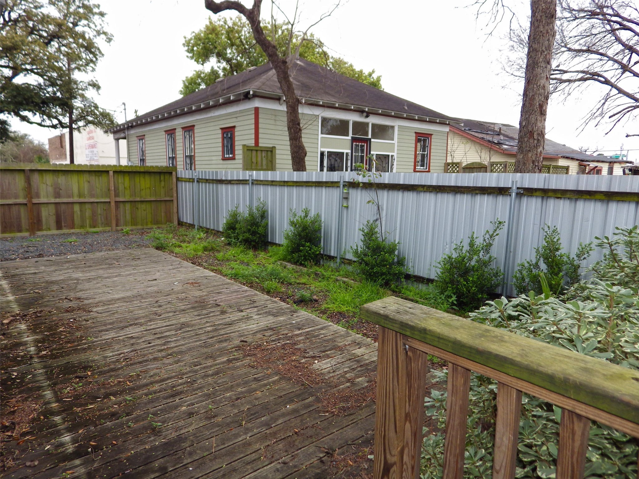 4322 Wilmer Street Houston, TX 77003 - Photo 27 of 31 a front view of a house with a yard and a garden